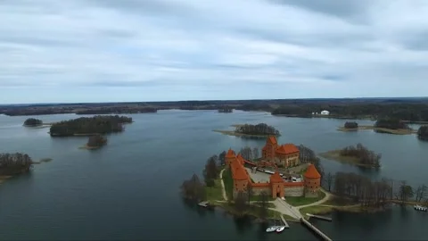  Trakai Island Castle in Lithuania on a cloudy day with views of the surrounding Stock Footage 328910004
