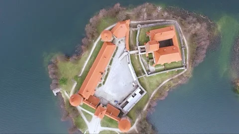  Trakai Island Castle in Lithuania on a cloudy day with views of the surrounding Stock Footage 328910005