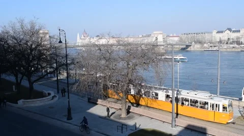 Tram and boat behind trees and Chain Bridge Stock Footage 47721624