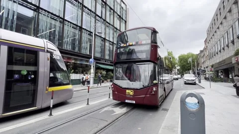 Tram and Bus in Dublin - gimbal walk Stock Footage