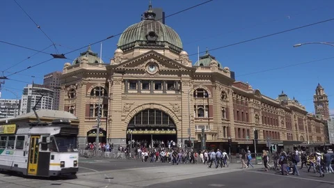 Tram and pedestrians at Flinders Street Station, Melbourne, Australia Stock Footage