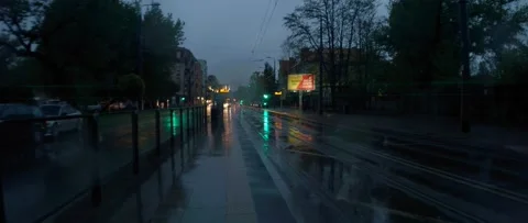 Tram approaching on a rainy evening Stock Footage 147407537