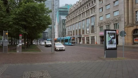 A Tram at Augustusplatz in Leipzig, Germany in the Evening on a Rainy Summer Day Stock Footage 247146512