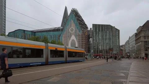 A Tram at Augustusplatz in Leipzig, Germany in the Evening on a Rainy Summer Day Stock Footage 247147758