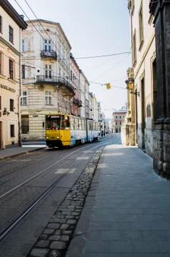 Tram on the background of the old city of Lviv. Stock Photos