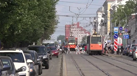 Tram on centrally located segregation during the evening rush Stock Footage 64638768