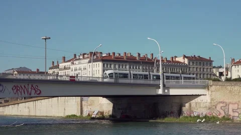 Tram crosses River Rhone bridge, Lyon, France Stock Footage 285651797