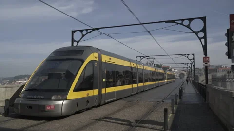 Tram crossing Luis I Bridge in Porto Stock Footage 237341599