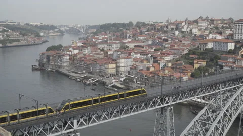 Tram crossing Luis I Bridge in Porto Stock Footage 237341628