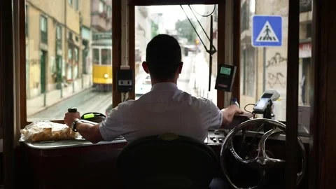 Tram driver of historic tram train streetcar in Lisbon Inside famous old trolley Video stock 222155137
