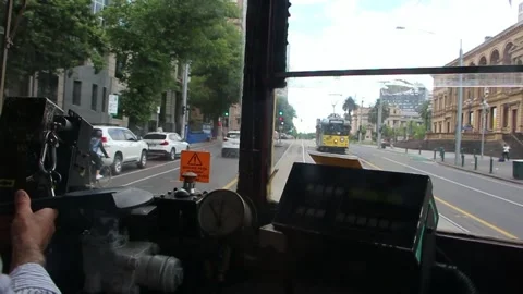 Tram driver in melbourne dashboard visible passing buildings other trams Stock-Footage 145732348