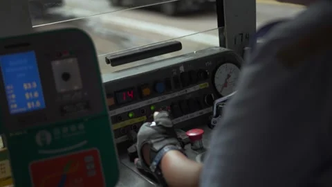 Tram driver operating controls in hong kong Stock Footage 313880853