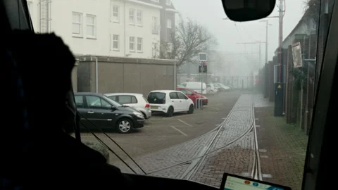 Tram driver's point of view driving on a foggy day in Amsterdam Stock Footage 334786027