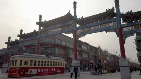 Tram driving through Chinese ancient archway in tourism spot Qianmen, Beijing. Stock Footage 150240767