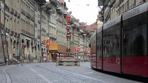 Tram driving through the empty city center, establisher public transportation Stock Footage 277544873