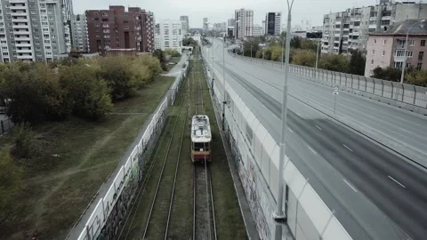 The tram goes through the area painted with graffiti Stock Footage 162037813