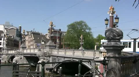 Tram going over bridge in Amsterdam Stockbeeldmateriaal 12668591