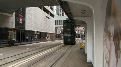 Tram going past passenger stop in Hong Kong Video stock 45995066