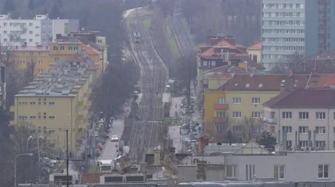 Tram going through city in distance - no color grading Stock Footage 61361137