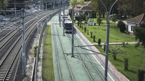 Tram going under the bridge Stock Footage 166239679