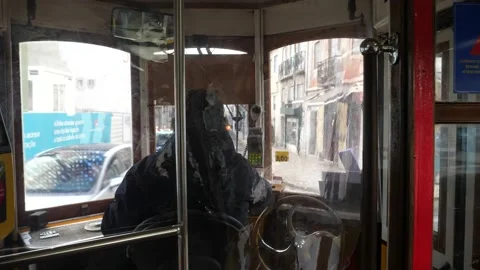 Tram interior with the driver in Lisbon - Line 28 Stock Footage 231791483