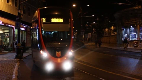 Tram with Lights is Driving Towards Camera at Night in Istanbul, Turkey Video stock 87760051