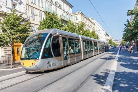 A tram makes its way through the centre of the city Stock Photos