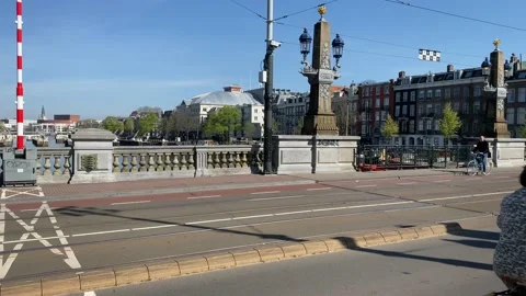 Tram over hogesluis bridge over the Amstel canal. Stock Footage 133901199