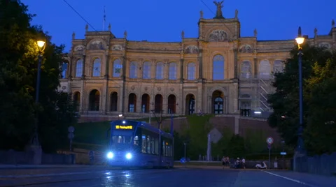 Tram passes in front of Atheneum Munich Stock-Footage 50983178