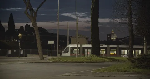 Tram passing by Circus Maximus, Saint Peter's basilica chapel in backgorund Stock Footage 127857083
