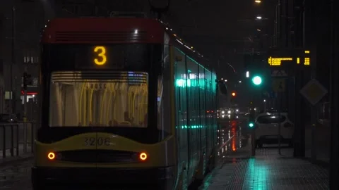 Tram passing by on a rainy night. Stock Footage 147407583