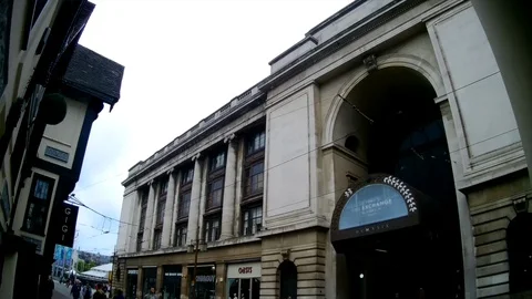 A tram passing the side of the Nottingham Council House Stock Footage 108551032