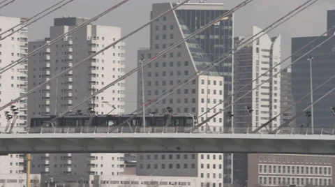 Tram passing through bridge in Rotterdam Video stock 65928995