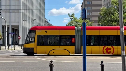 Tram Passing Through a Busy Main Street in Warsaw, Poland Stock Footage 345122334