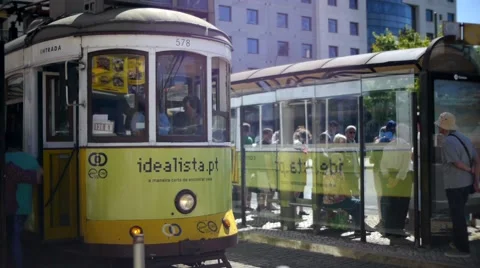 Tram pulling away from stop in Lisbon Stock Footage 41804732