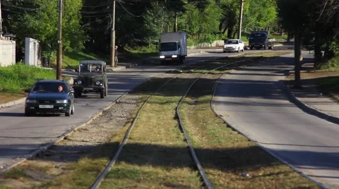 Tram rails. On both sides of the road moving vehicles. Stock Footage 64380893