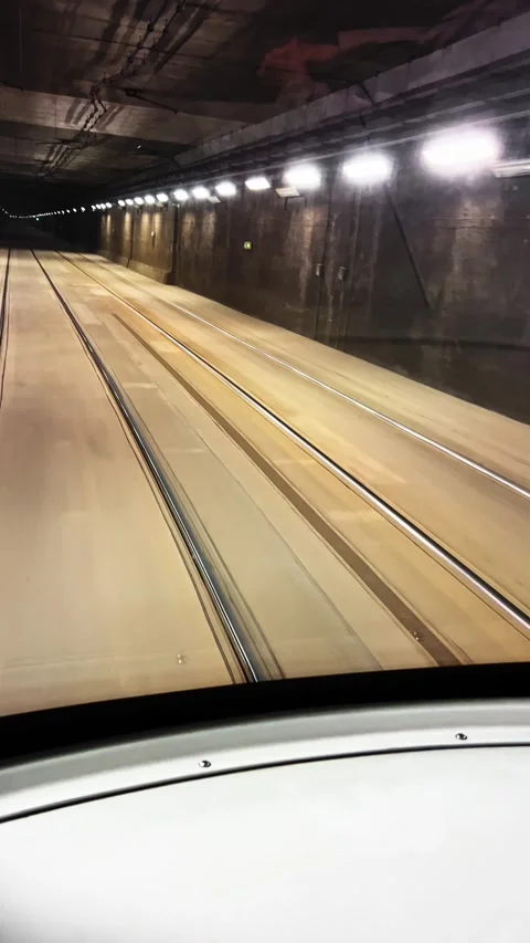 Tram smoothly navigating underground tunnel, revealing dynamic perspectives from Stock Footage 307853017