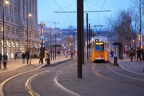 Tram at a stop in the city centre Stock Photos