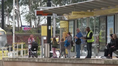 Tram Stop Commuters Stock Footage 79651777