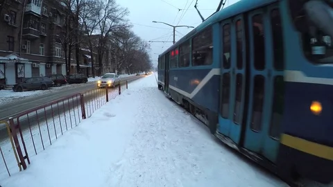 The tram in the street. Winter. Evening. Stock Footage 86573137