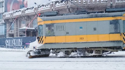 The tram is sweeping the rails from the snow Stock Footage 186981592