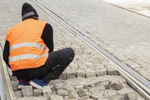 Tram track cobblestone worker Stock-Fotos