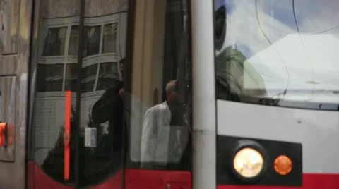 Tram train in Vienna - reflection of people walking Stock Footage 22242024