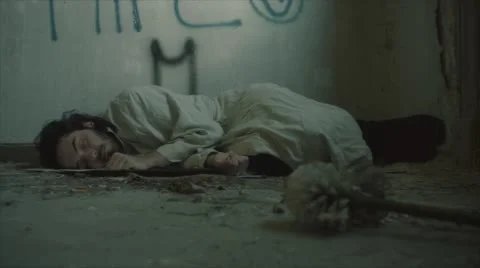 Tramp sleeping in an abandoned house Stock Footage 64530330