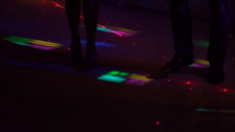 Trample down the floor in a nightclub. Friends dancing at night. Stock Footage 100347660