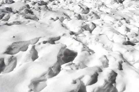 Trampled snow pattern from unknown boots or animal tracks followed by a fresh Stock Photos