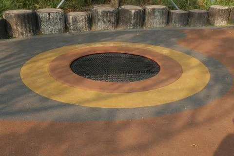 A trampoline-like bouncy ground with the shape of a circular iron frame 스톡 사진
