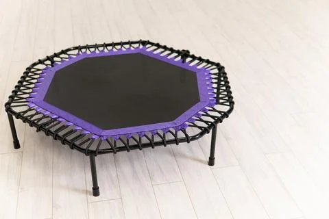 Trampoline small empty space growth jump game purple fitness cyan leisure white Stock-Fotos