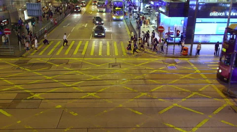 TRAMS BUSES PEDESTRIANS CROSSING CENTRAL HONG KONG Stock Footage 67026431