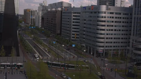 Trams crossing each other in rush hour in downtown central Rotterdam with Stock Footage 115502261